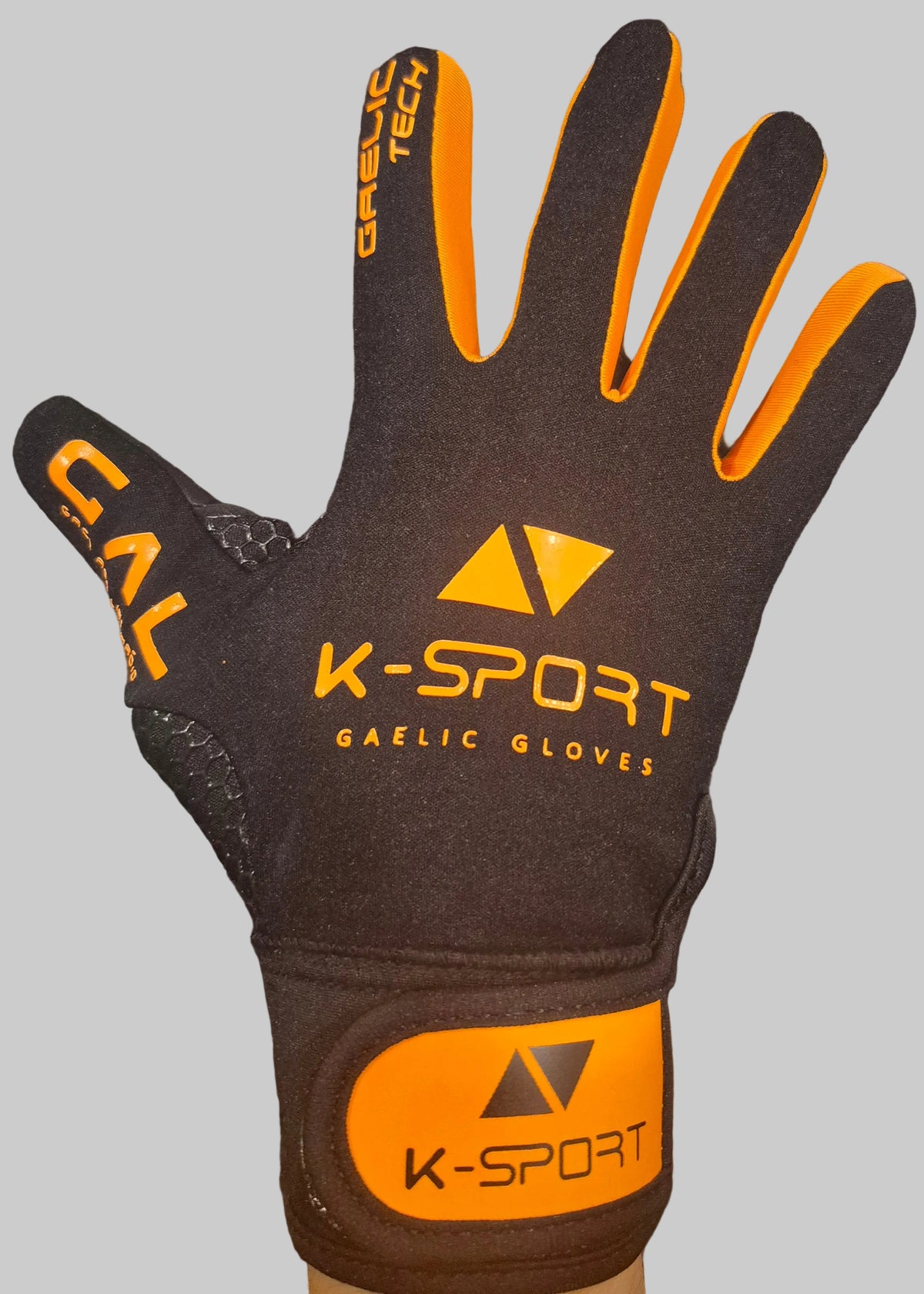 Black/orange gaelic football gloves with black wrist strap, all weather grip