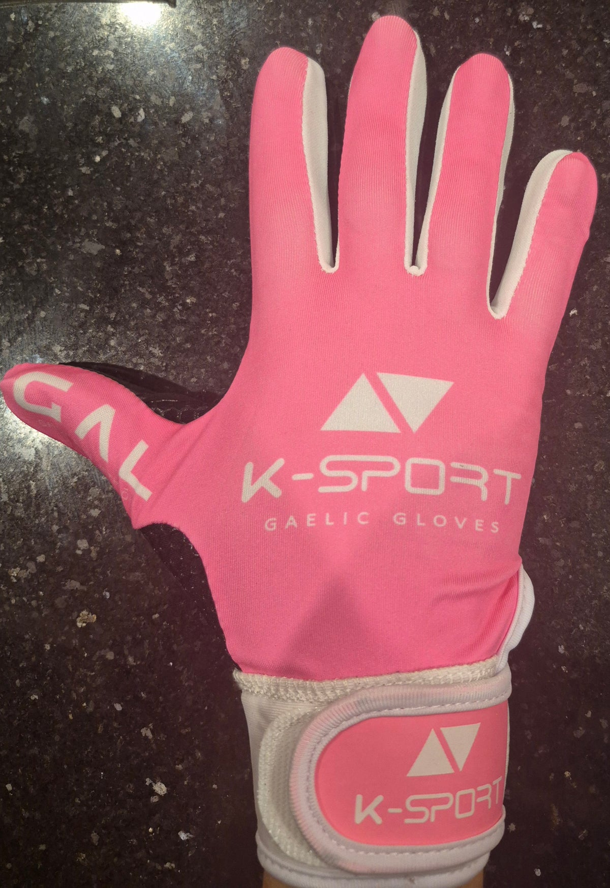 Pink / white gaelic football gloves with black wrist strap, all weather grip